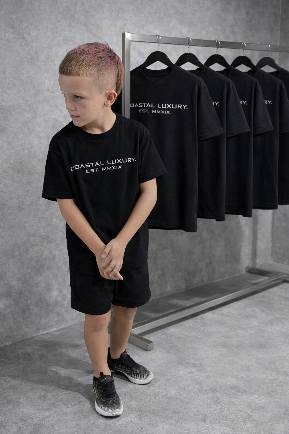 LITTLE LUXURIES.                                            COASTAL LUXURY.             (YOUTH) PREMIUM SILHOUETTE BLACK TEE